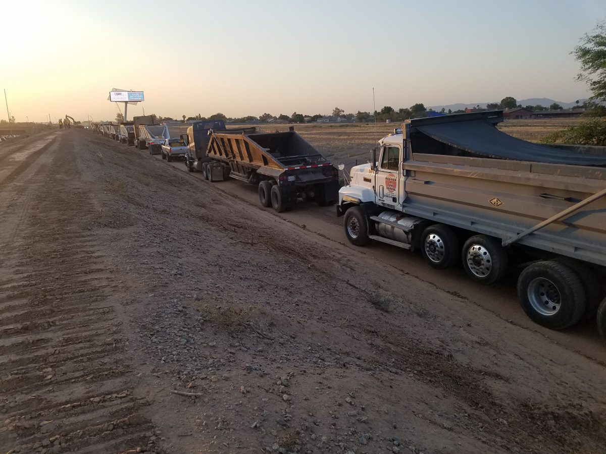Line-of-Trucks-Quad-Axle-Bottom-or-Belly-Dump-1200x900