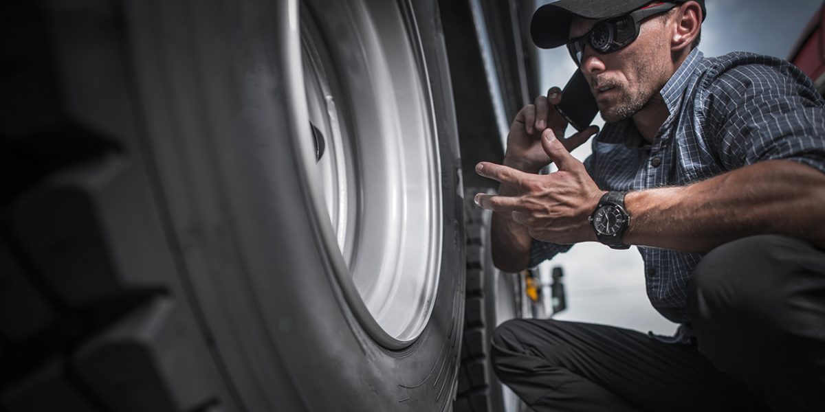 truck-driver-ordering-new-wheels-PQS885A-1200x600