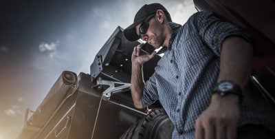 trucker-driver-holding-phone-400x202